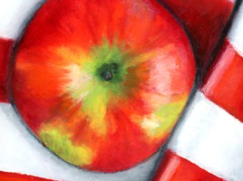 Red Apple on red striped cloth